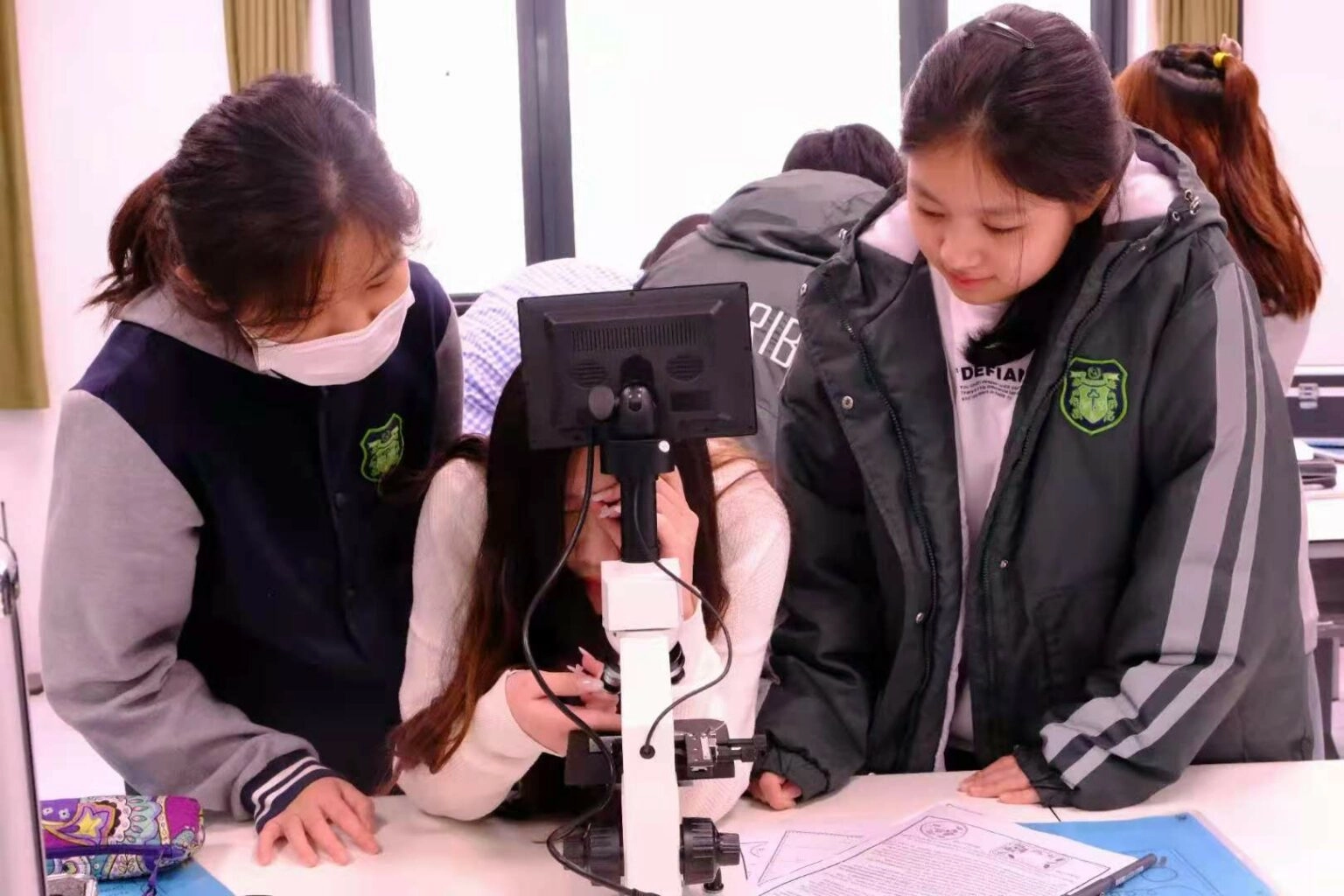 Girls making file and doing readings at Rosedale Ontario Secondary School Diploma program
